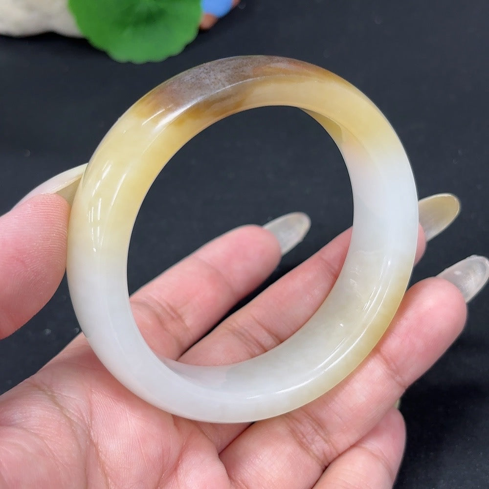 Round Hetian Jade bracelet, size 56.8, weighing 74.5g, from HKHQ, featuring smooth jade beads on a natural skin tone background.