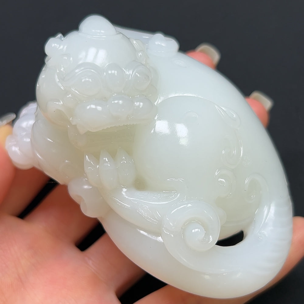 HKHQ Hetian Jade Pi Xiu hand piece showing detailed carved jade figure with a total weight of about 296.22g.