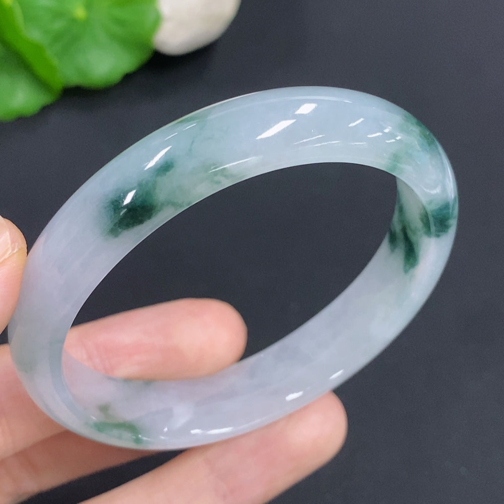 Jadeite concubine bracelet with green jade stones, size 55.5/47.5, weighing approx. 38g, from HKHQ.