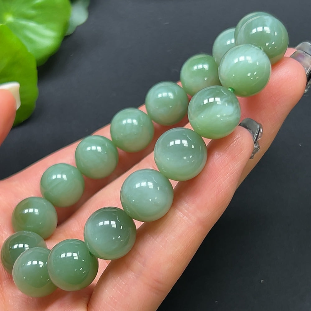 HKHQ Hetian Jade bracelet featuring 11.8mm jade beads with a total weight of 44.38g, showcasing smooth, polished green jade stones.