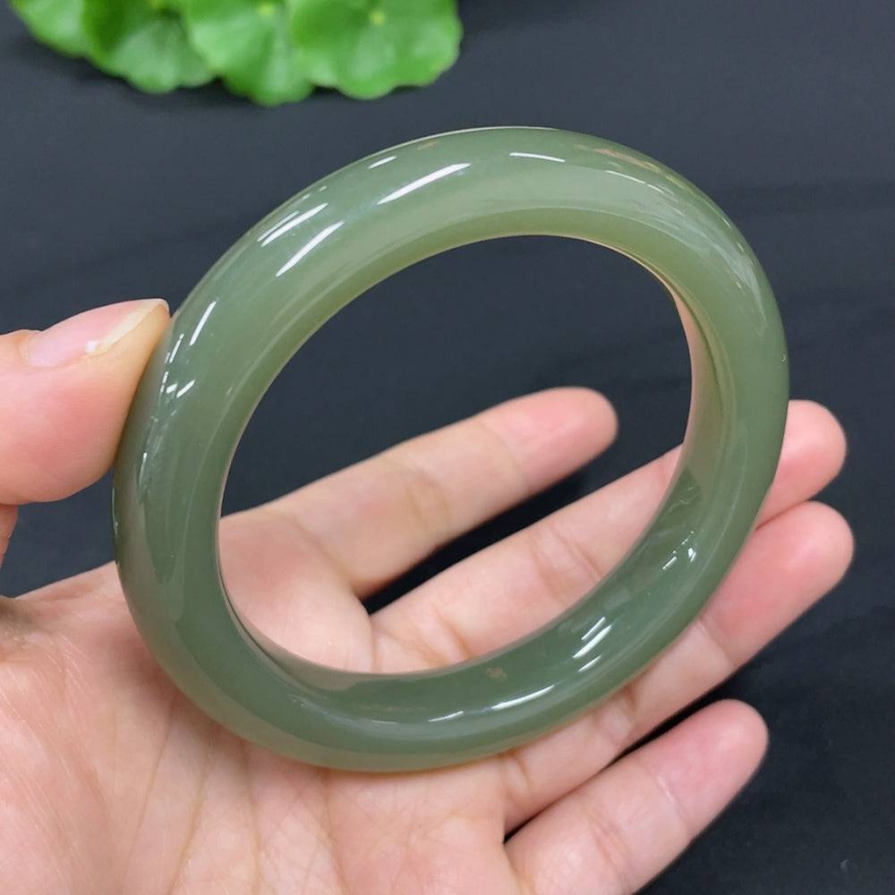 Huiliu certified Hetian jade round bracelet with smooth polished jade beads, showcasing elegant craftsmanship and natural green hues.