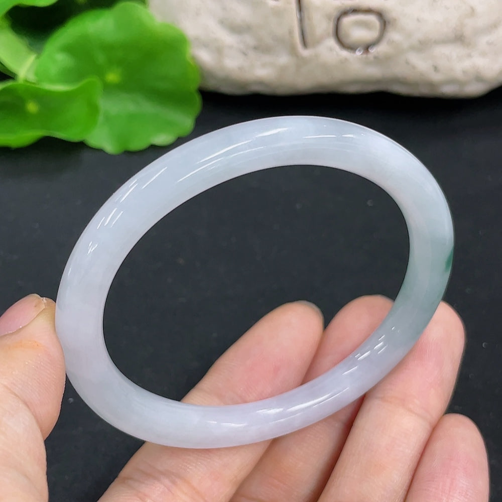 Elegant jadeite concubine bracelet by HKHQ featuring smooth, polished jade stones in a traditional design.