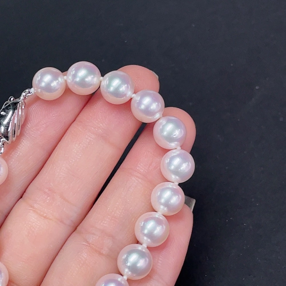 Saltwater pearl bracelet by HKHQ featuring elegant white pearls on a non-gold bracelet design.