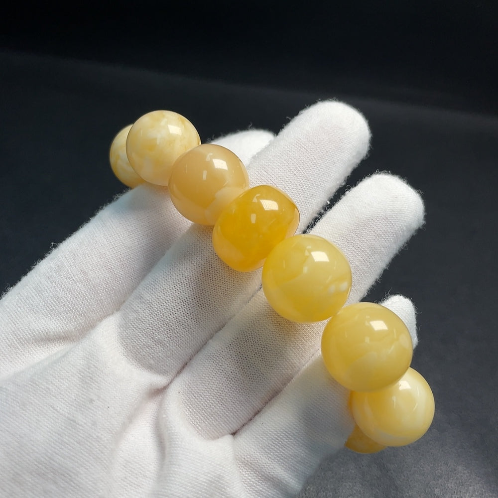 Huiliu Certified Amber Beeswax Bracelet featuring warm amber beads, natural jewelry piece with a smooth, polished finish.