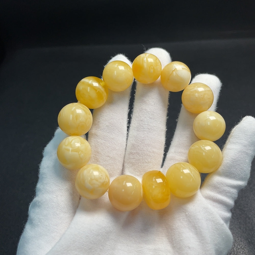 Huiliu HQ Amber Beeswax Bracelet featuring natural amber beads, handcrafted and certified by Huiliu for quality and authenticity.
