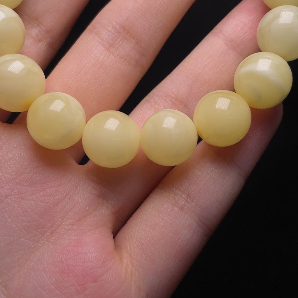 Huiliu Amber Beeswax Bracelet with non-natural stones, 12.3mm size, featuring amber beads and decorative non-accent stones.