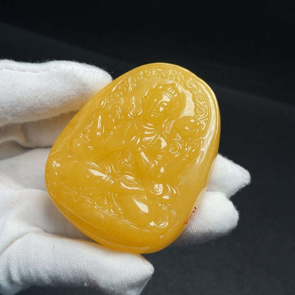 Amber beeswax pendant from HUILIU HQ with visible partial repairs, showcasing natural amber and craftsmanship.