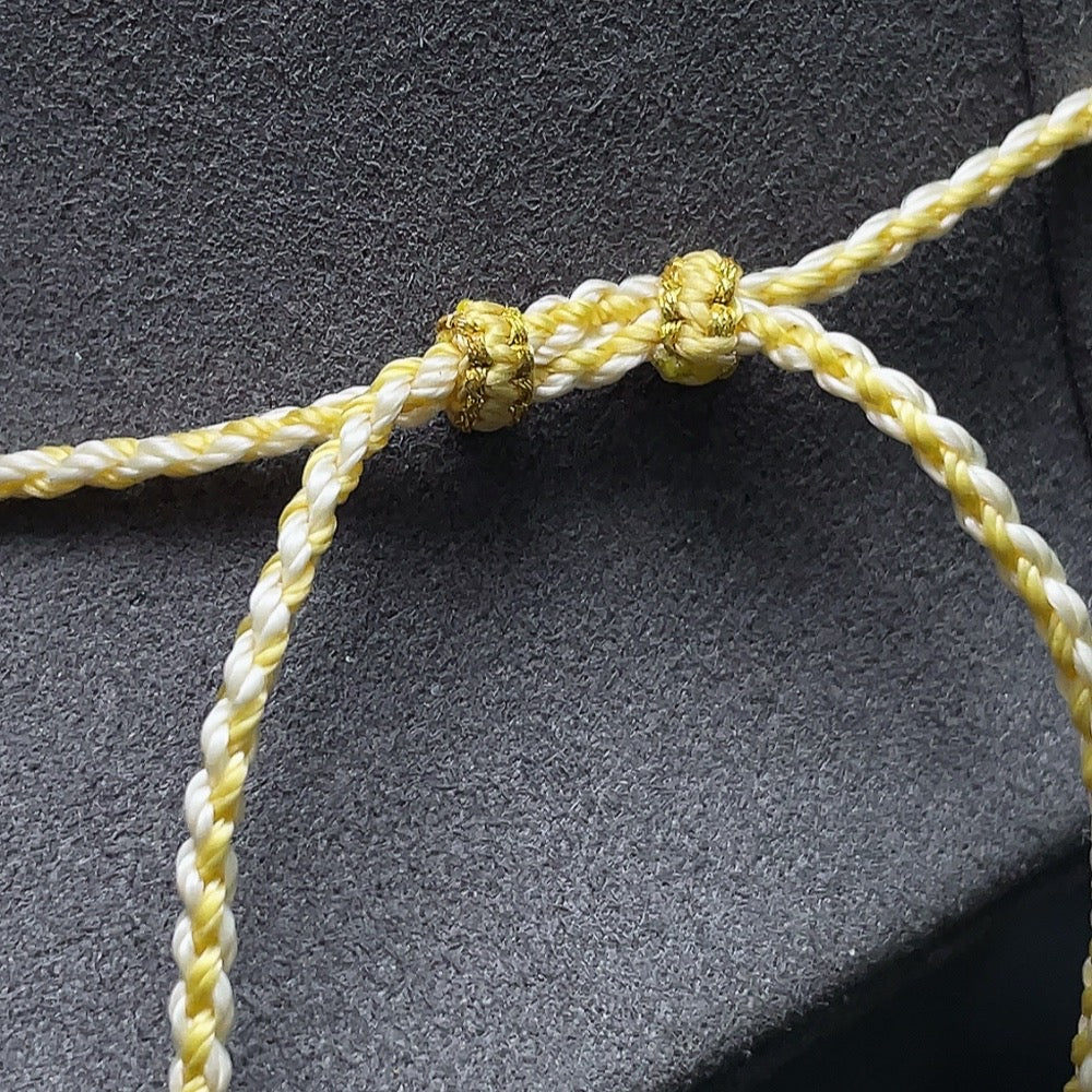 Amber beeswax pendant by HUILIU HQ featuring partial visible repairs, showcasing natural amber texture and craftsmanship.