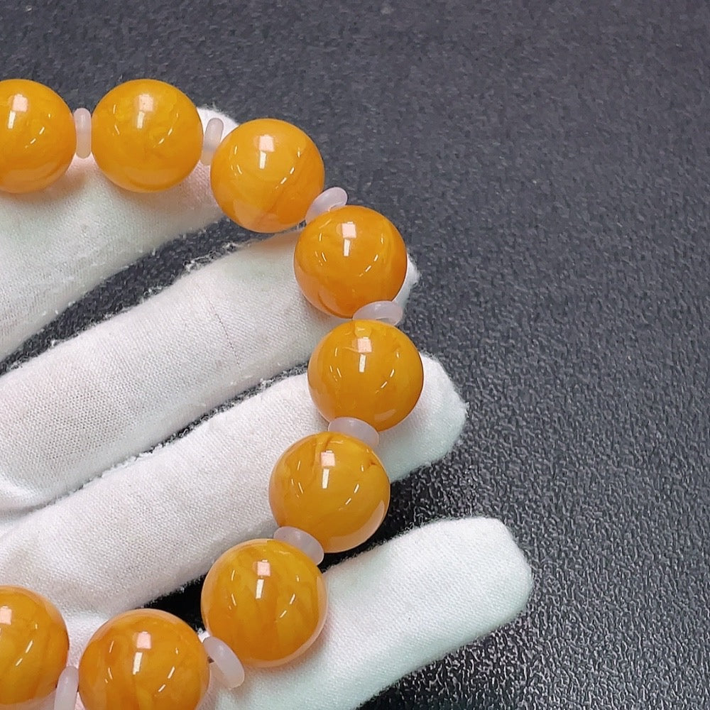 Amber Honey Wax Bracelet by HUILIU HQ, 16mm size with partial repairs, visible stones, weighs approx. 31.9g, natural amber stones.
