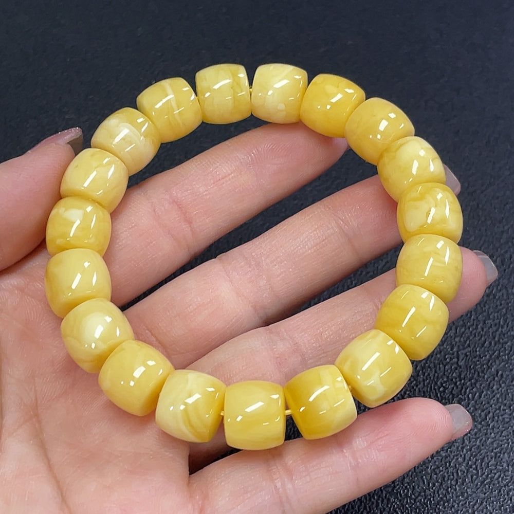 Natural Grade A jadeite amber beeswax bracelet by HUILIU HQ, featuring smooth amber beads on a delicate string.