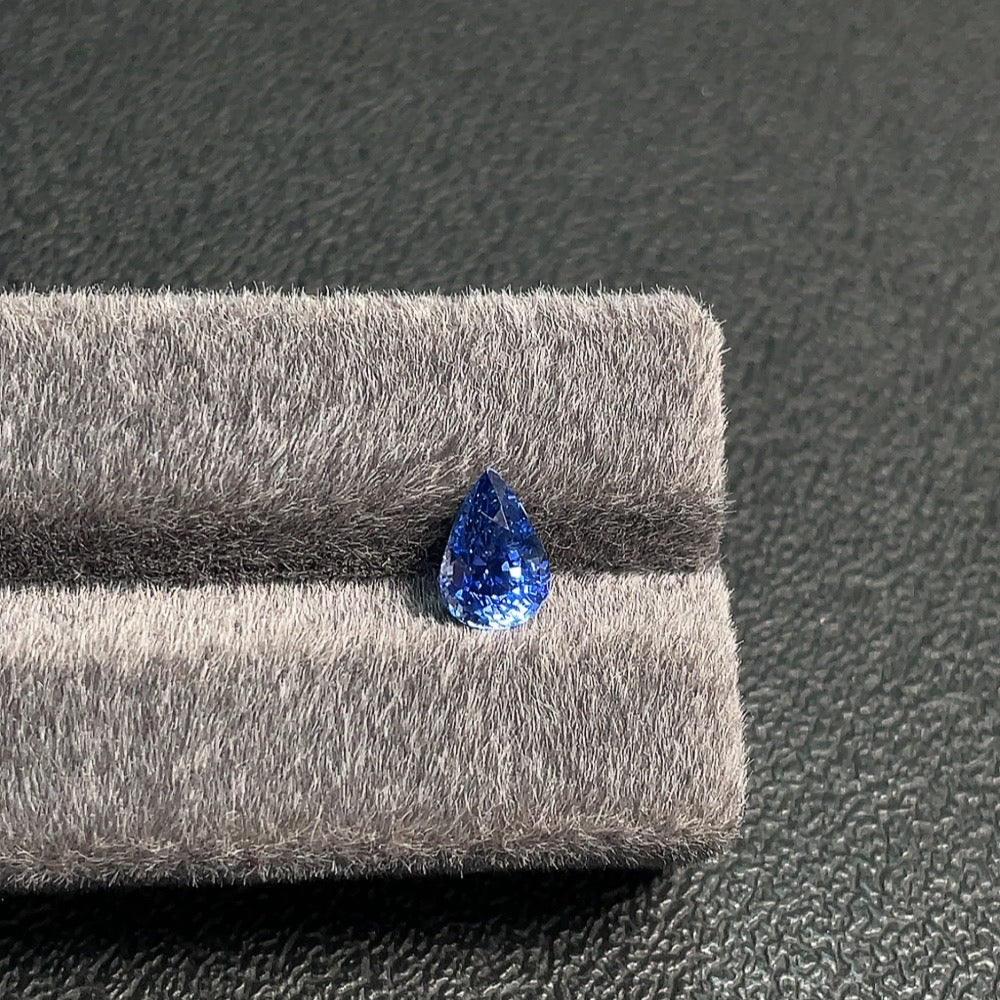 Natural Grade A Jadeite Sapphire loose gemstone, approximately 2.01 carats, certified by Huiliu, showcasing vibrant blue color and clarity.