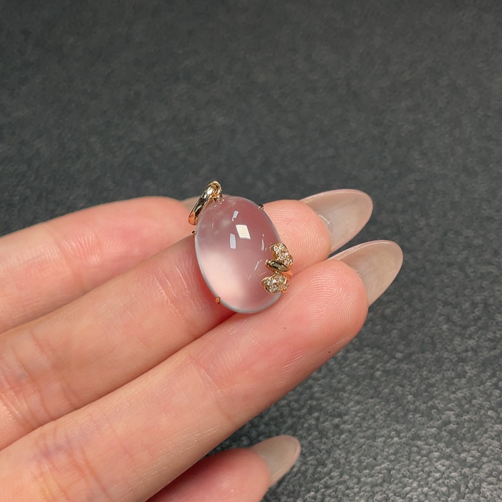 Prehnite pendant with diamond accents from HUILIU HQ, showcasing a polished gemstone and sparkling diamond details.