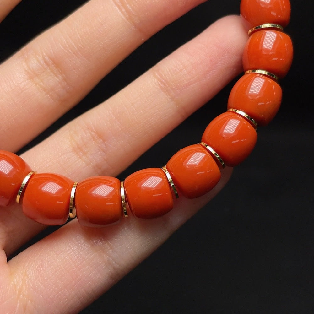 Red Agate gemstone bracelet with visible organic inclusions, 10mm beads, non-gold, weighing approximately 37.6g, by HUILIU HQ.