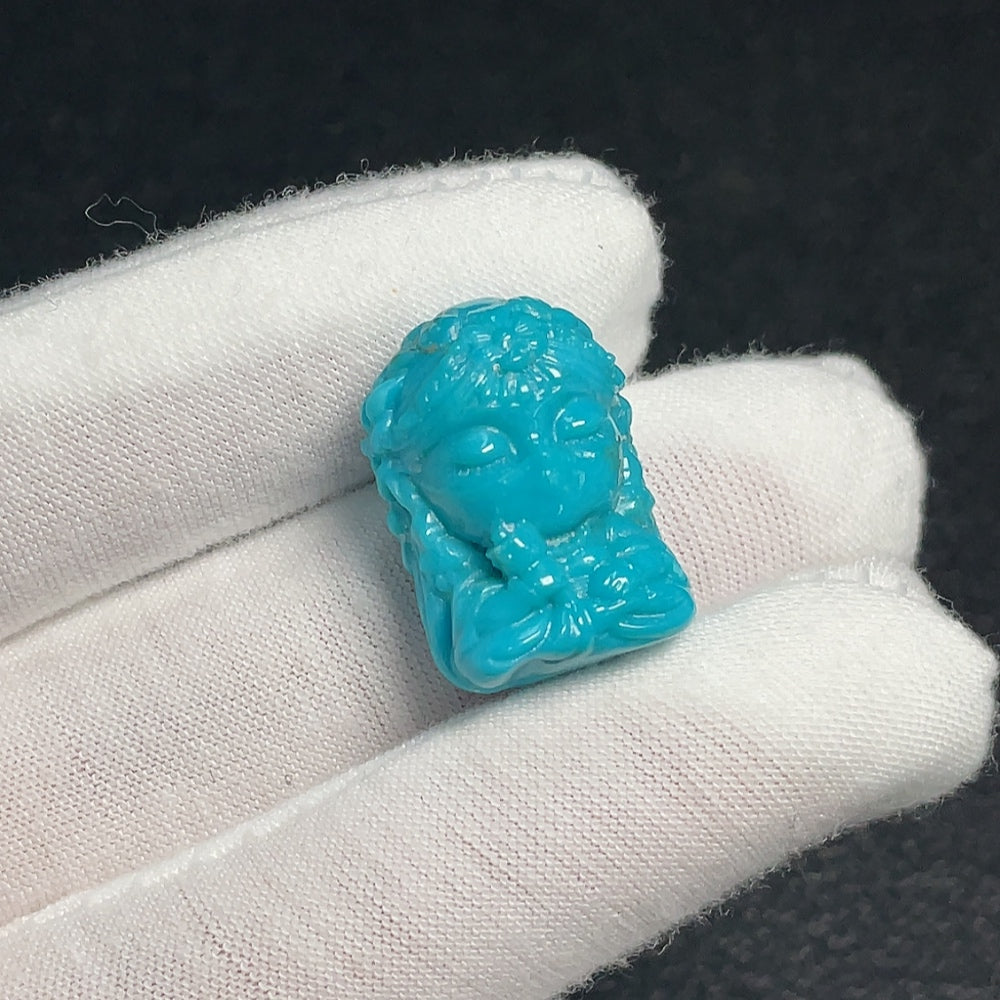 Huiliu Certified turquoise gemstone pendant with an undetermined color, featuring a polished oval shape and natural gemstone appearance.
