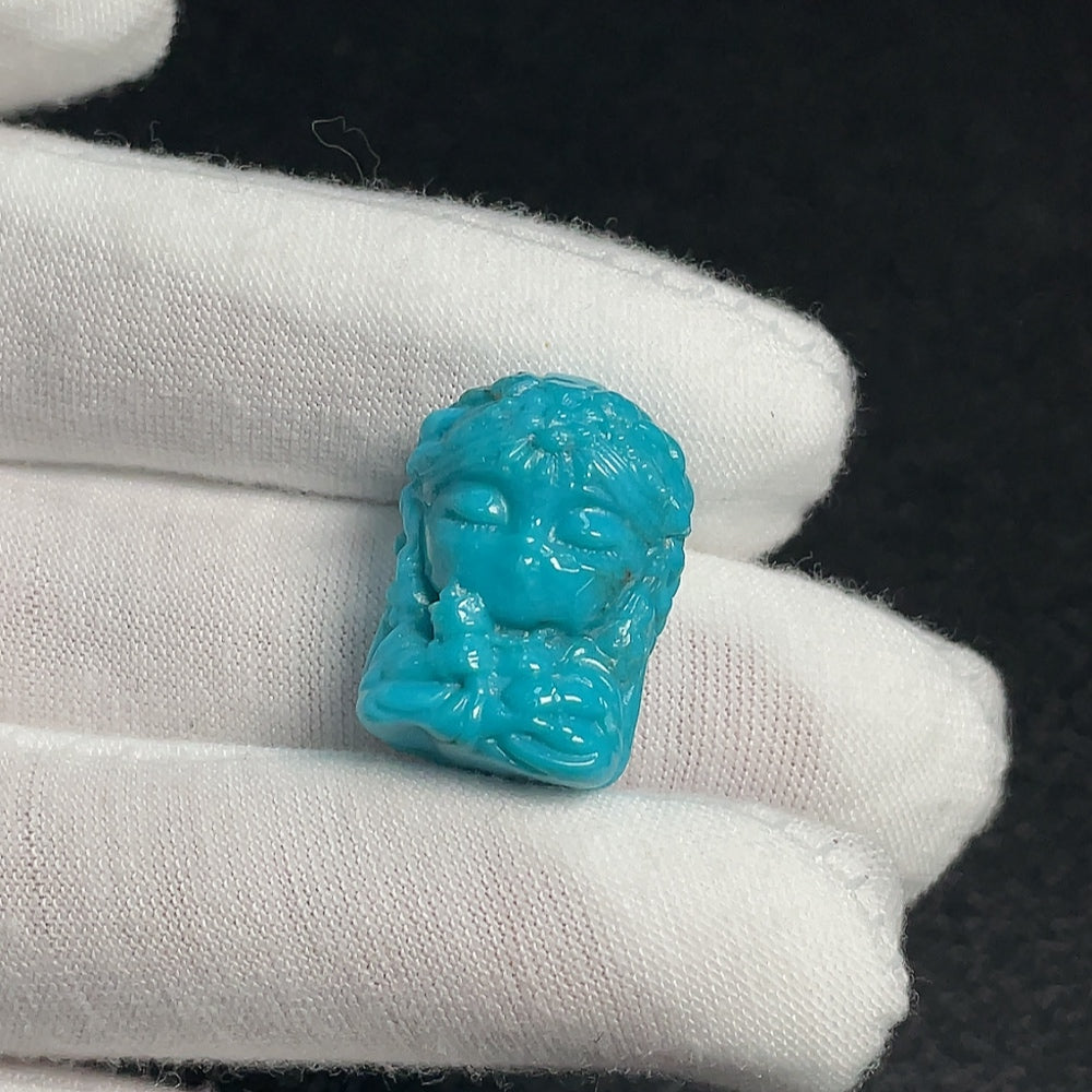 Turquoise gemstone pendant by HUILIU HQ, with an undetermined color origin and natural stone appearance.