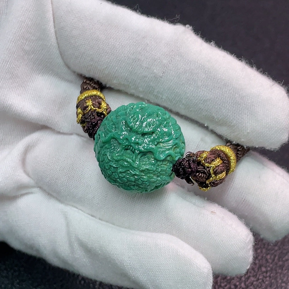 Turquoise gemstone pendant weighing approx. 18.03g with a 21.3x20.4mm rope, featuring vibrant blue-green color and natural stone texture.