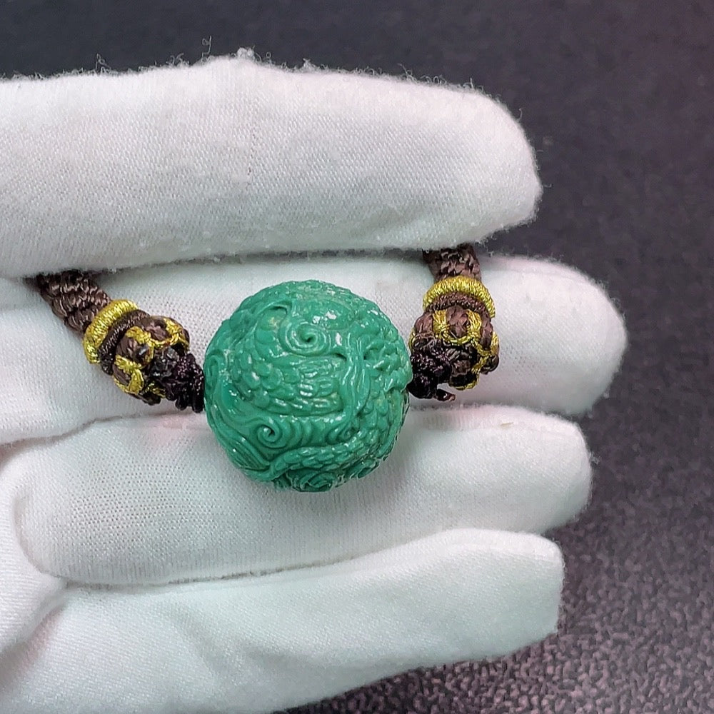 Turquoise gemstone pendant with rope, weighs approx. 18.03g, measuring about 21.3x20.4mm, by HUILIU HQ.