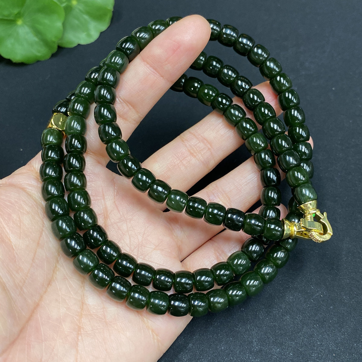 Huiliu Hetian Jade Bead Necklace with 6.6mm non-inlaid jade beads, showcasing smooth, polished stones on a transparent background.