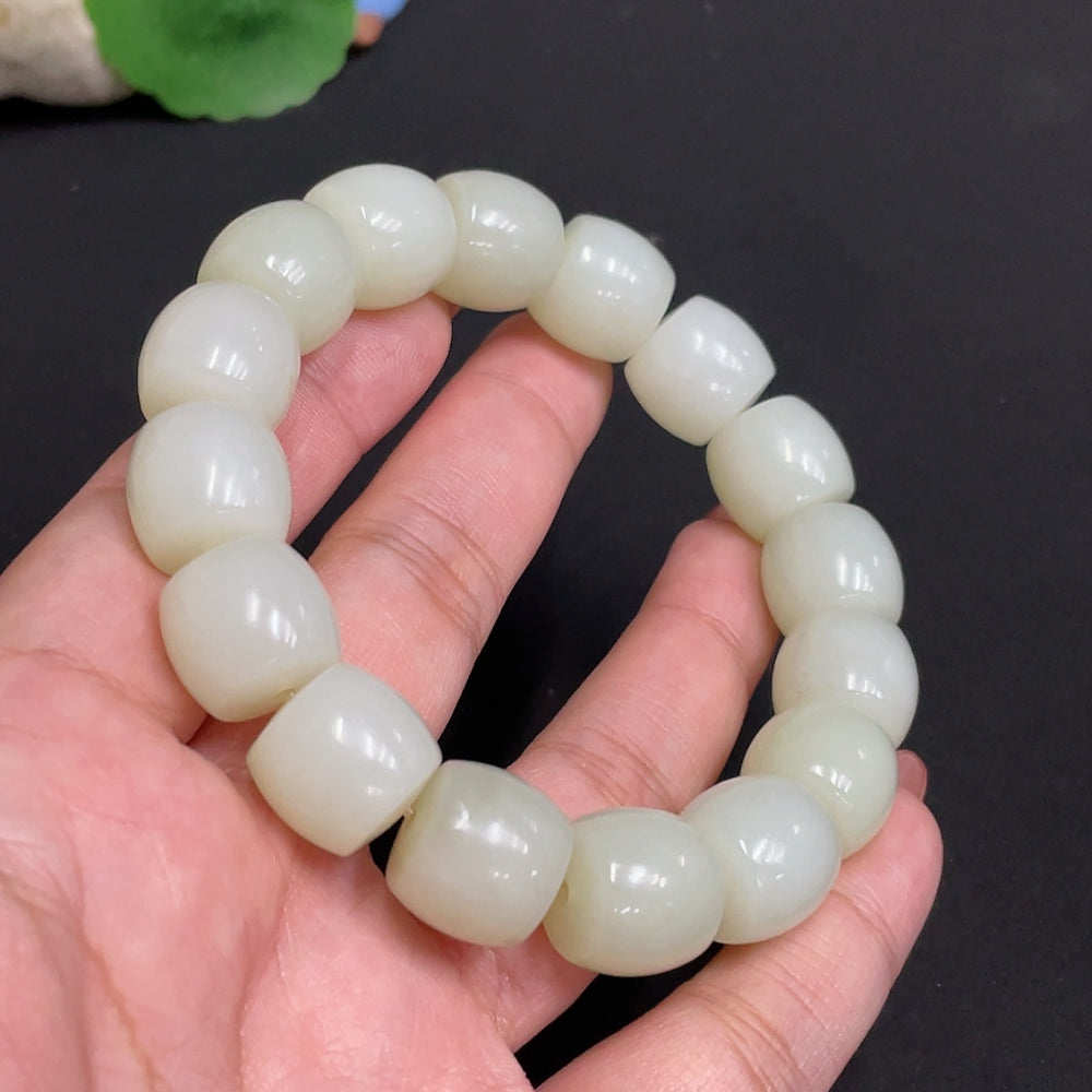 Huiliu Hetian Jade bracelet with 13.5mm beads, natural green jade, and certified Huiliu branding on a white background.