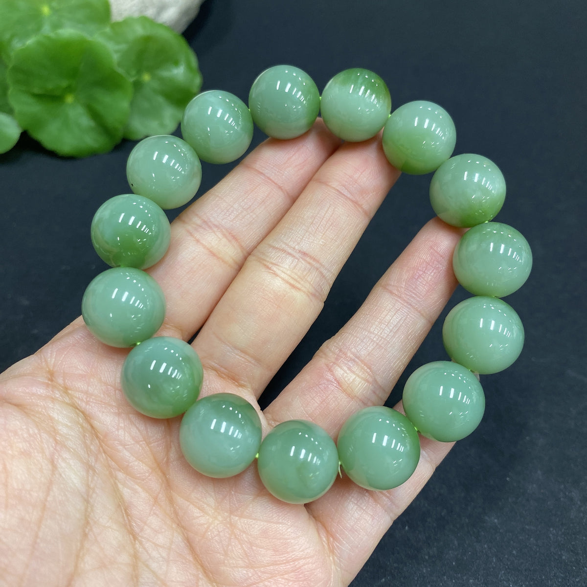 Huiliu Certified Hetian Jade bracelet with 13.5mm round jade beads, showcasing smooth, polished jade on a delicate bracelet.