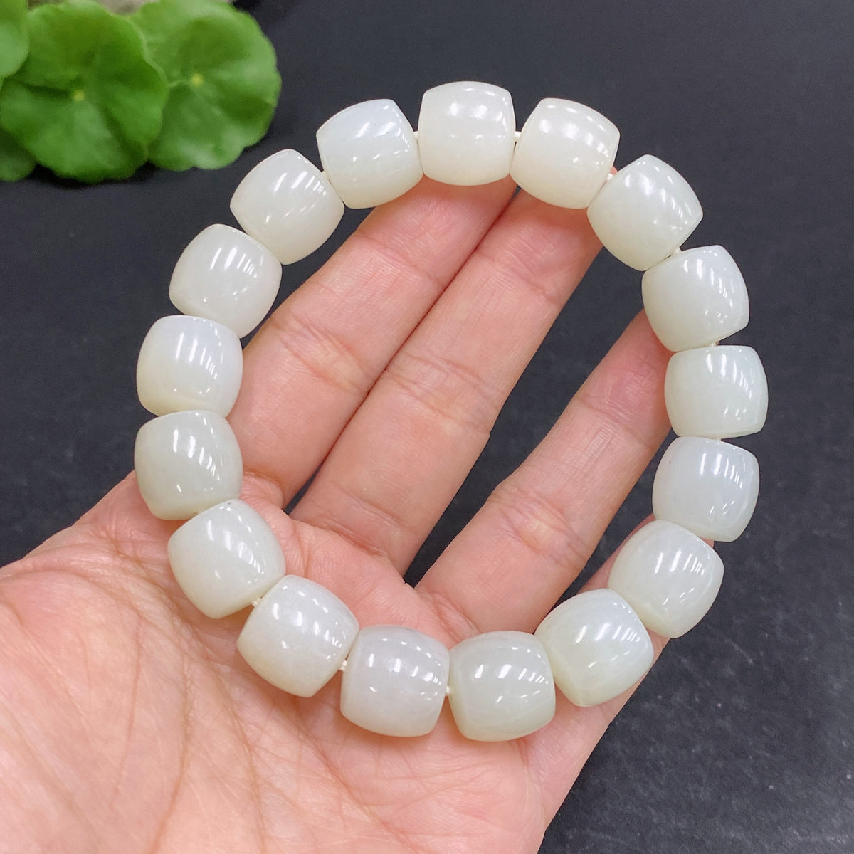 Hetian Jade bracelet with 12.6mm beads, approximately 63.7g, crafted by HUILIU HQ, showcasing smooth green jade stones.