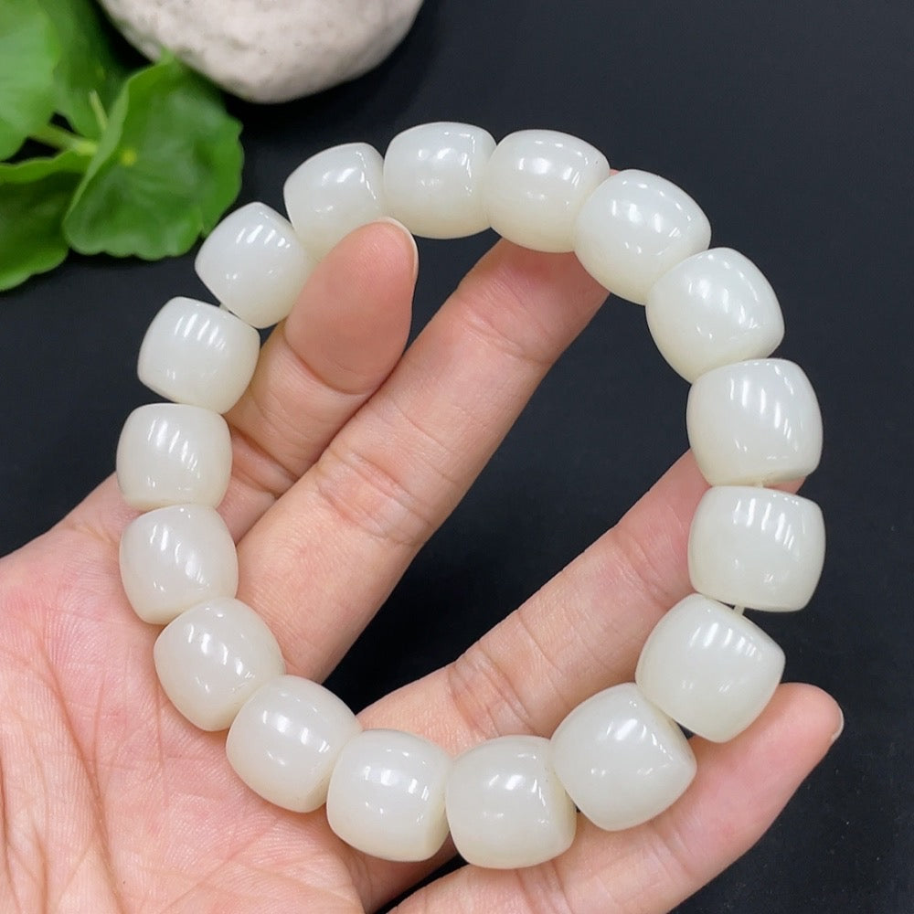 Huiliu HQ Hetian Jade bracelet featuring 13.1mm jade beads, totaling approximately 63g, showcasing smooth, polished green jade stones.