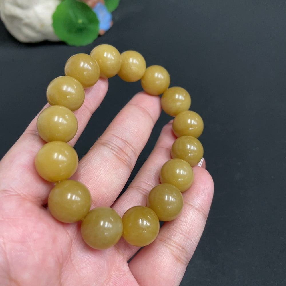 Hetian Jade bracelet by HUILIU HQ featuring 13.6 mm stones and a total weight of 61.7g, showcasing smooth, polished jade beads.