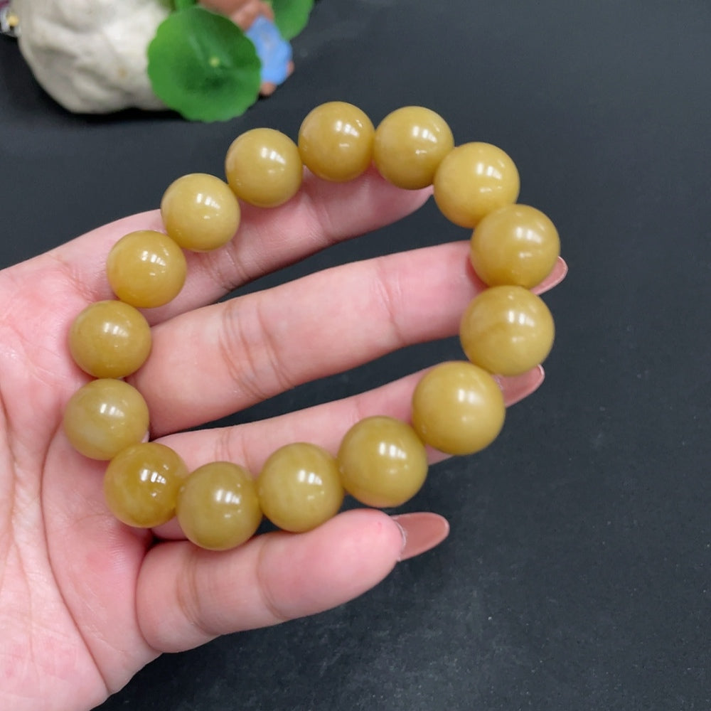 Huiliu HQ Hetian Jade bracelet with 13.6mm stones, total weight 61.7g, showcasing smooth, polished jade beads on a string.