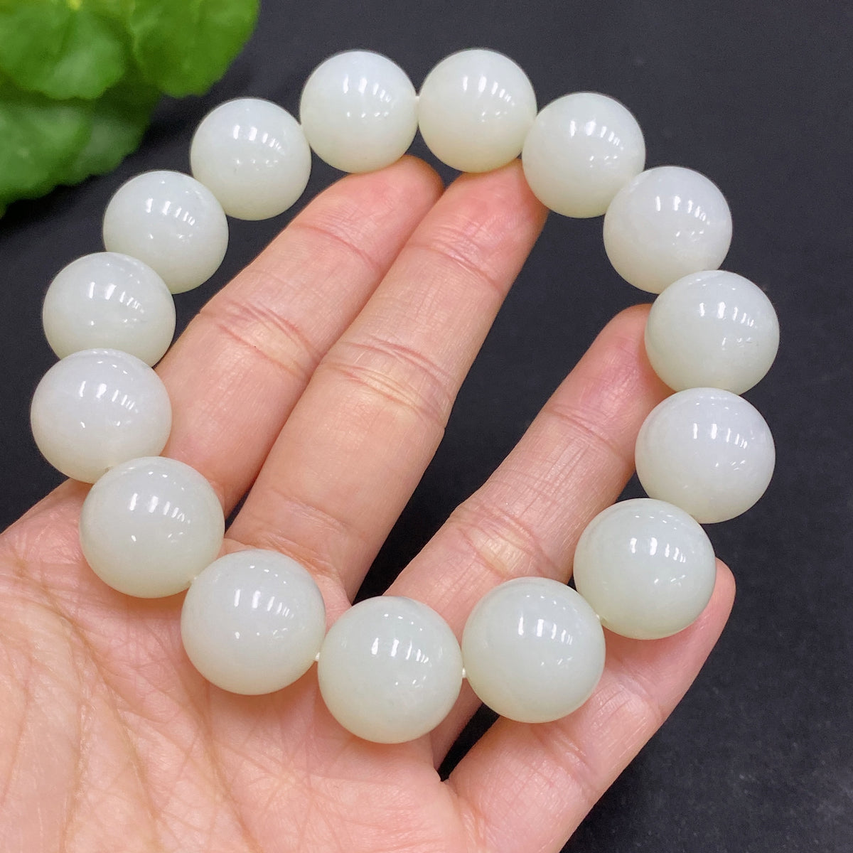 Huiliu HQ Hetian Jade bracelet with 14.8mm beads, totaling approximately 77.9g, showcasing smooth, polished green jade beads.