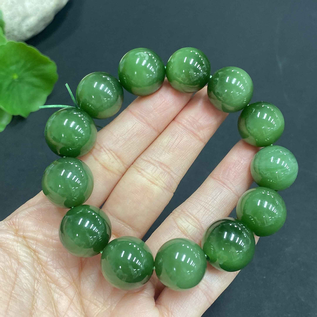 Huiliu HQ Hetian Jade bracelet with 15.2mm beads, weighing approximately 68.4g, showcasing smooth jade stones on a delicate bracelet
