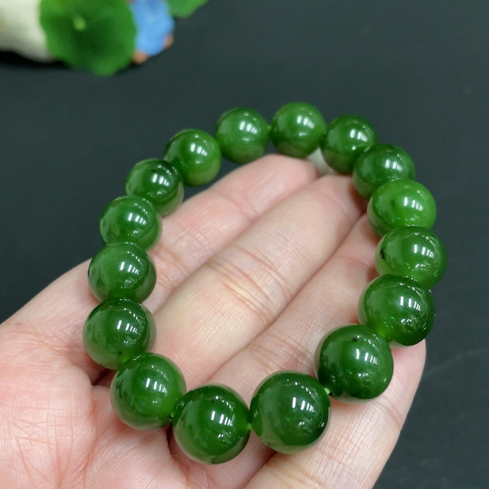 Huiliu HQ Hetian Jade bracelet with 11.9mm beads, approximately 43.9g, showcasing smooth, polished jade stones on a natural background.