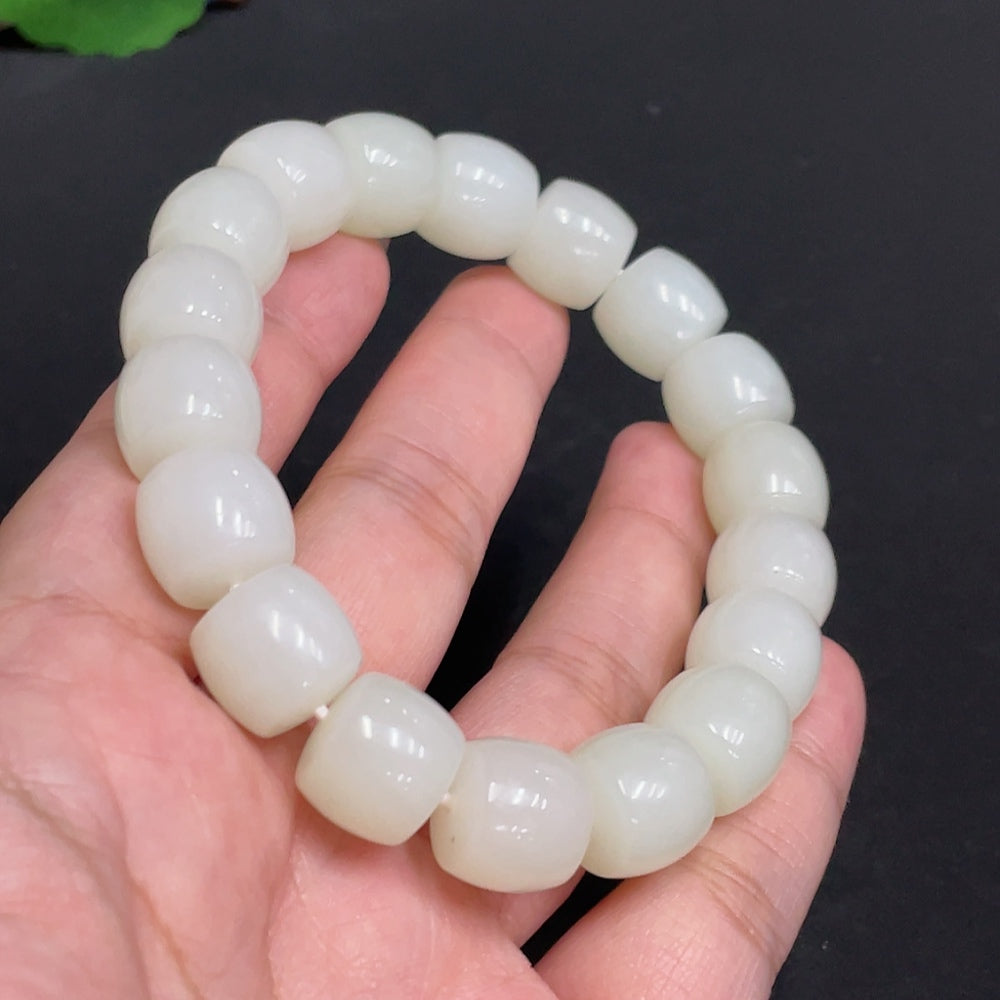 Hetian jade bracelet by HUILIU HQ with 12.9mm beads, total weight 65g, showcasing smooth, polished jade stones.
