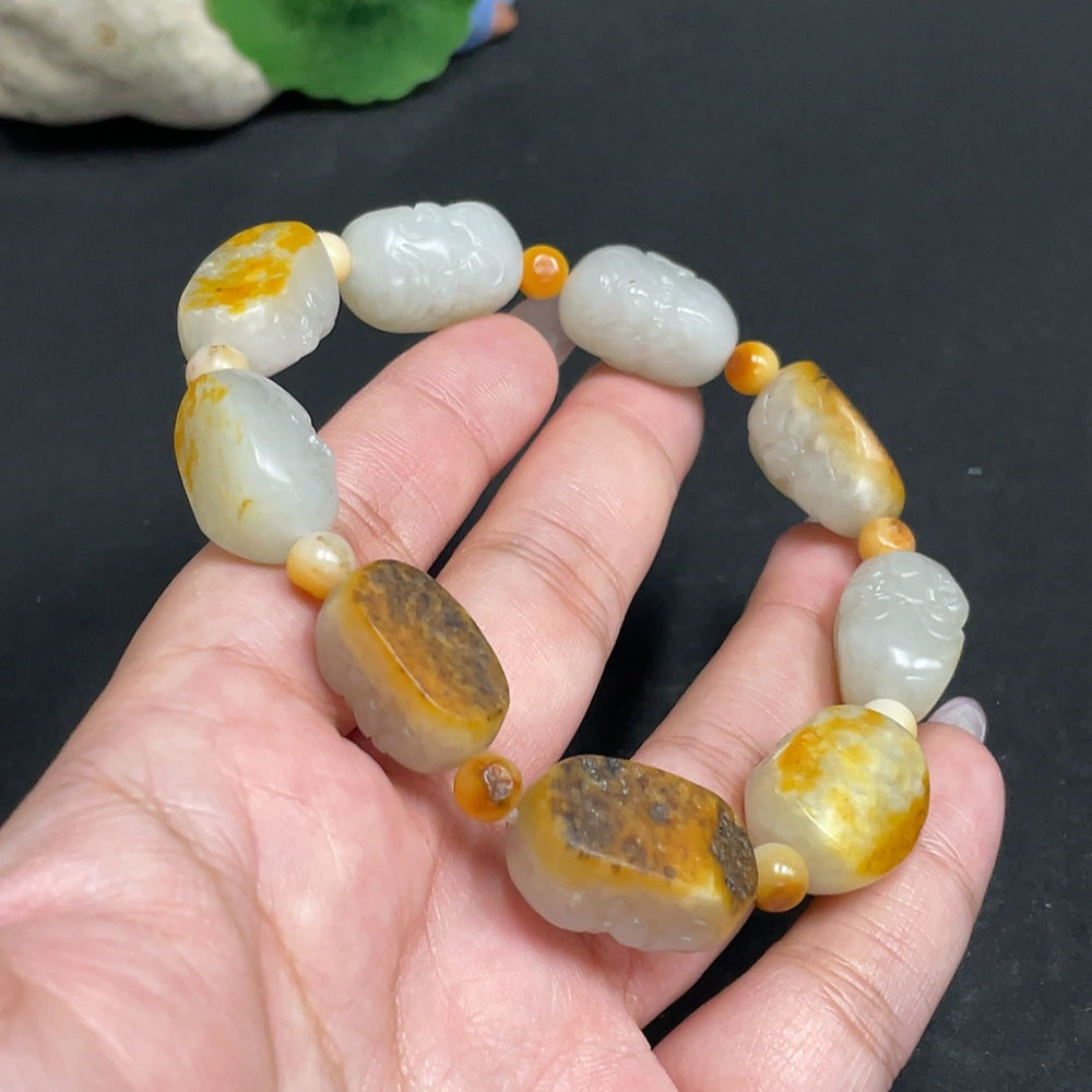 Huiliu Certified Hetian Jade Eighteen Arhats bracelet with intricately carved jade Arhats, showcasing traditional craftsmanship.
