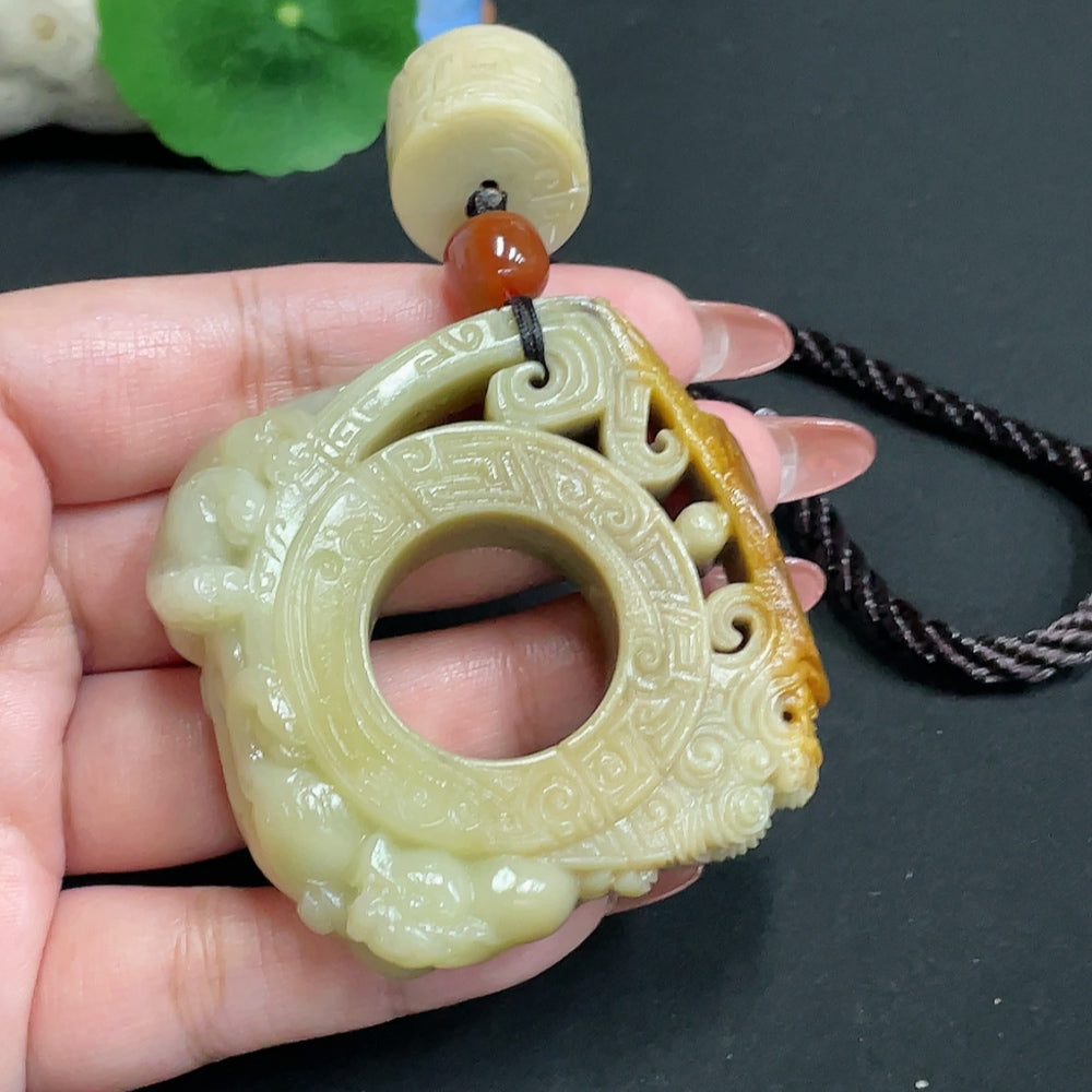Huiliu HQ Hetian jade handheld carving in antique style, showcasing intricate details and smooth polished surface.