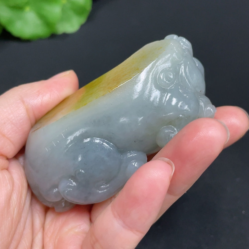 Huiliu certified Hetian jade handheld piece featuring an auspicious beast design in natural jade with undetermined skin color.