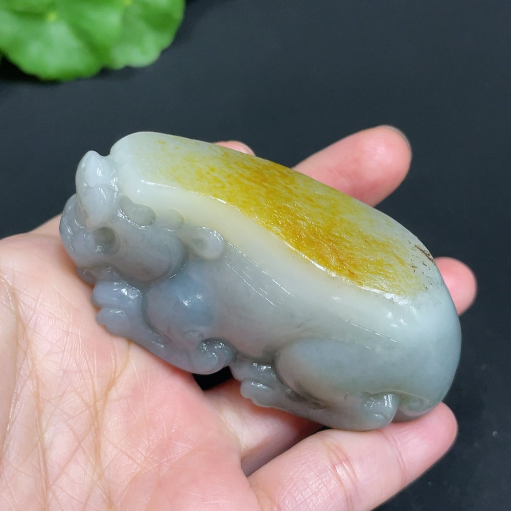 Huiliu certified Hetian Jade handheld piece featuring an auspicious beast design, with undetermined skin color, showcasing fine craftsmanship.
