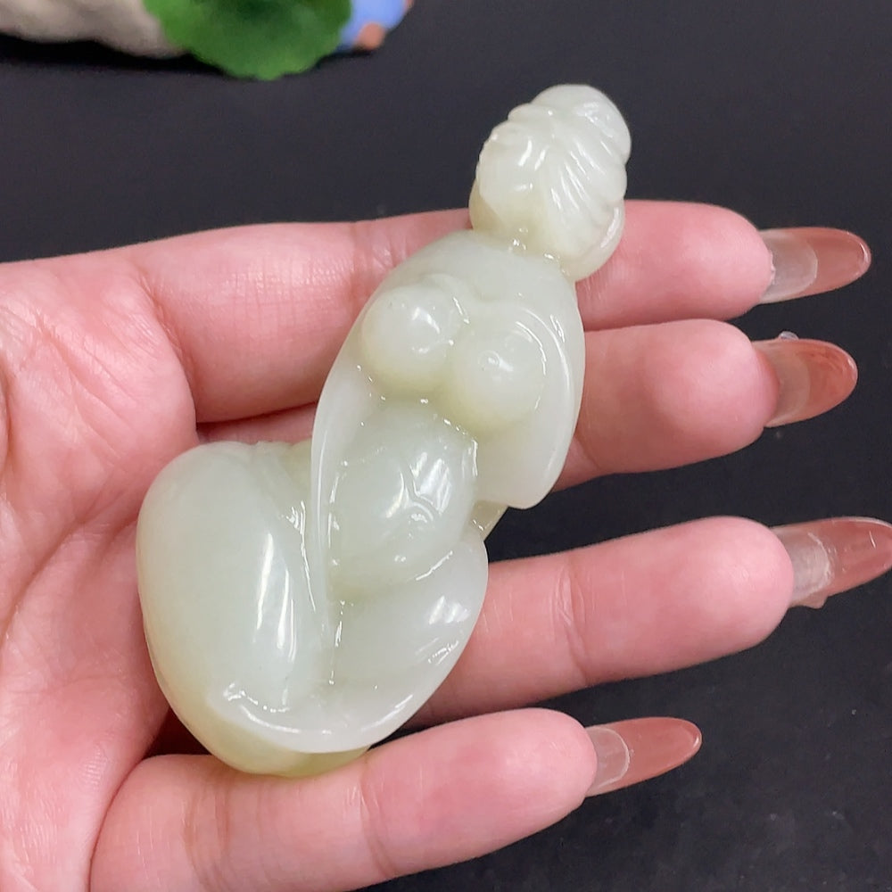 HUILIU HQ Hetian jade handheld piece with intricate carvings, weighing approximately 76.4g, showcasing traditional craftsmanship.