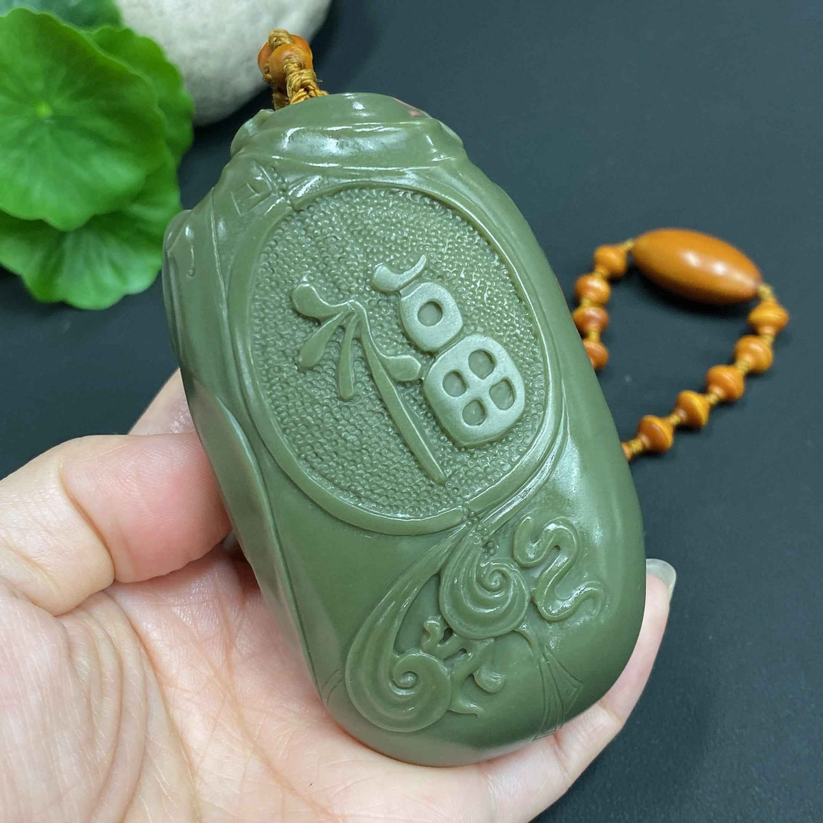 Huiliu HQ Hetian Jade handheld Zhong Kui figure, Huiliu certified, showcasing detailed craftsmanship and smooth jade surface.