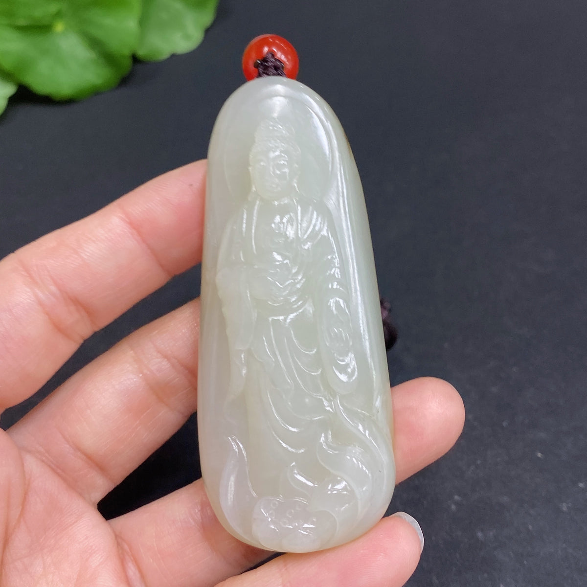 Hetian jade pendant featuring Amitabha Buddha, crafted by HUILIU HQ, showcasing detailed jade carving and religious symbolism.