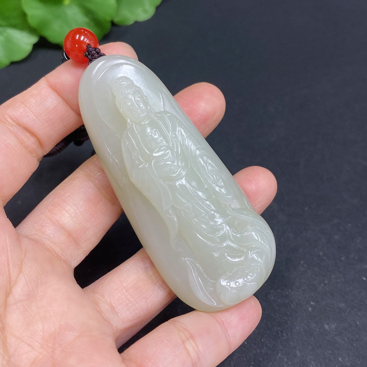 Hetian jade pendant featuring Amitabha Buddha, crafted by HUILIU HQ, showcasing detailed jade carving and religious symbolism.