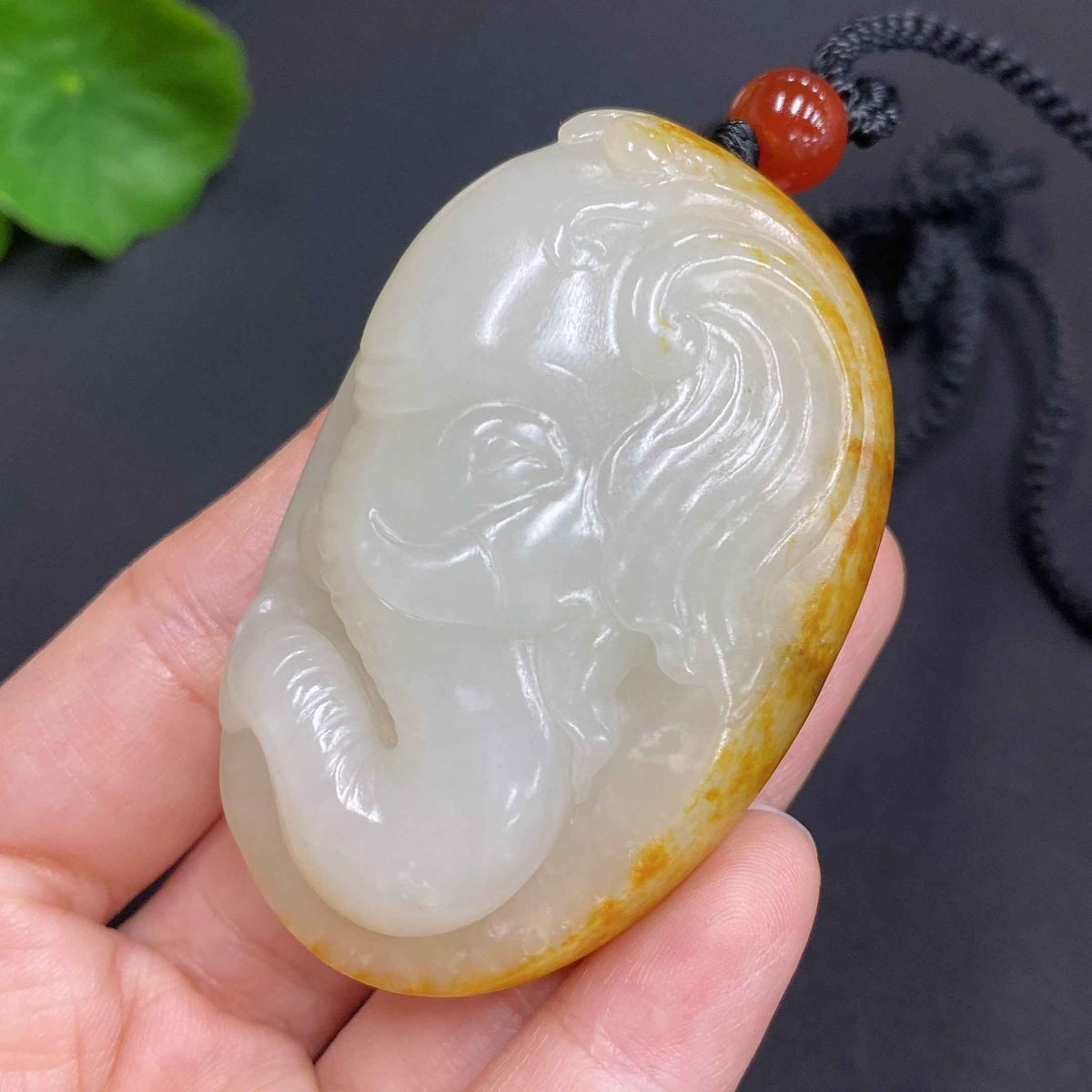 Huiliu HQ Hetian Jade Pendant with auspicious design, undetermined skin color, including rope, weighs approximately 85.7g.