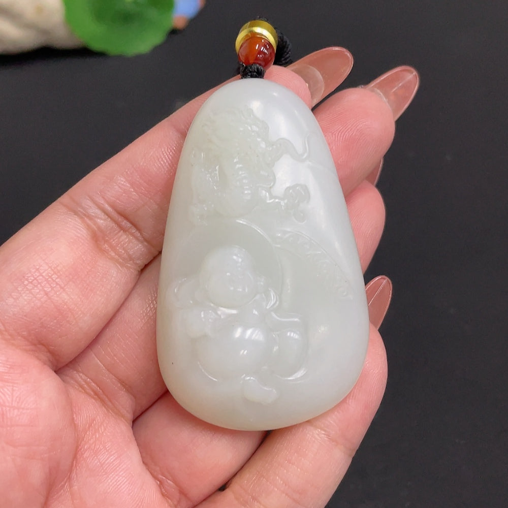 Huiliu certified Hetian jade pendant Buddha with rope, intricately carved in smooth green jade, showcasing traditional craftsmanship.