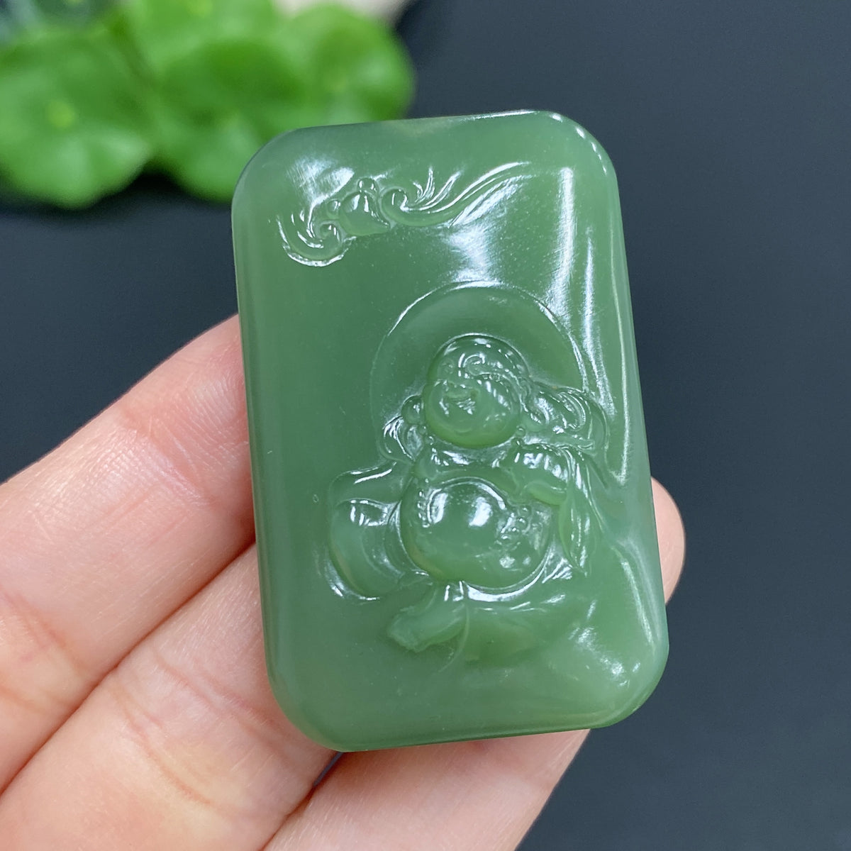 Hetian jade Buddha pendant by HUILIU HQ, handcrafted jade jewelry, weighs approximately 24.5g, featuring a detailed Buddha design.