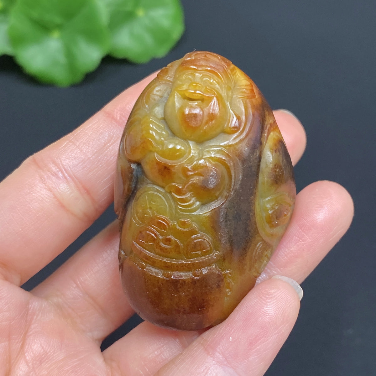 Hetian jade pendant featuring the God of Wealth, weighs approx. 62.2g, with natural mineral components and undetermined skin color origin.