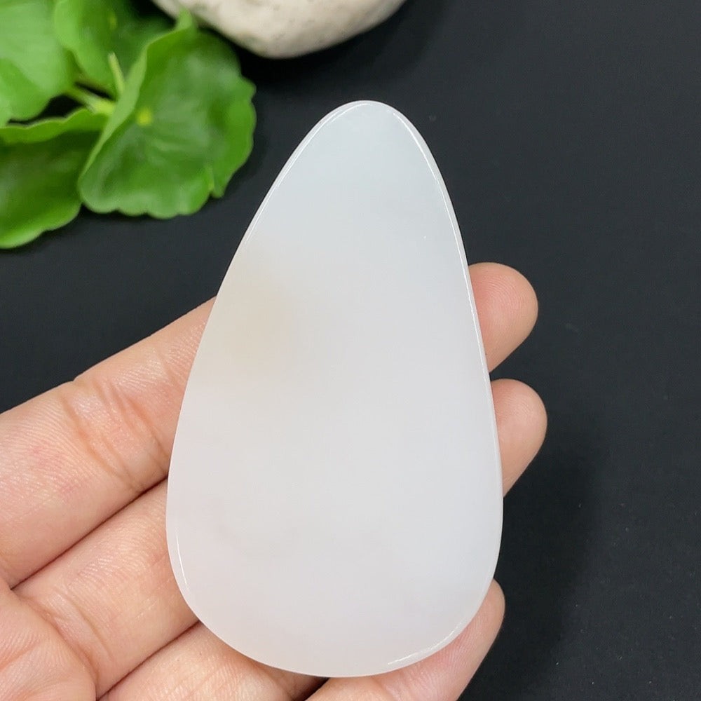 Huiliu certified Hetian Jade Guanyin pendant featuring detailed carved figure, traditional Chinese jewelry design.