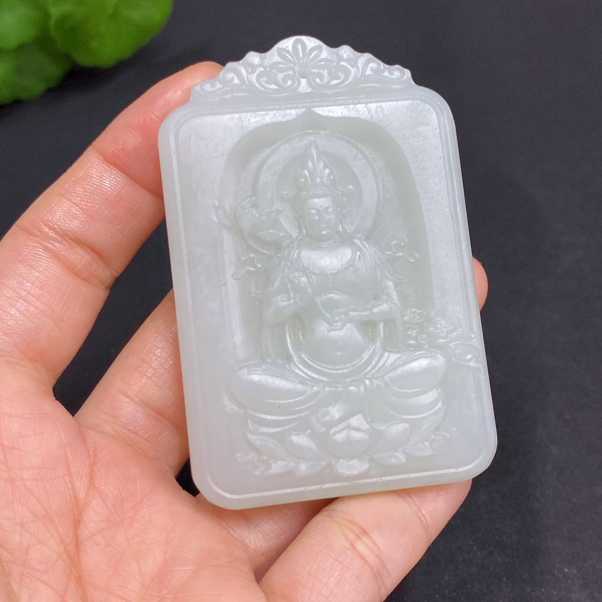 Huiliu Certified Hetian Jade Pendant featuring Guanyin figure, smooth polished surface, and intricate carvings.