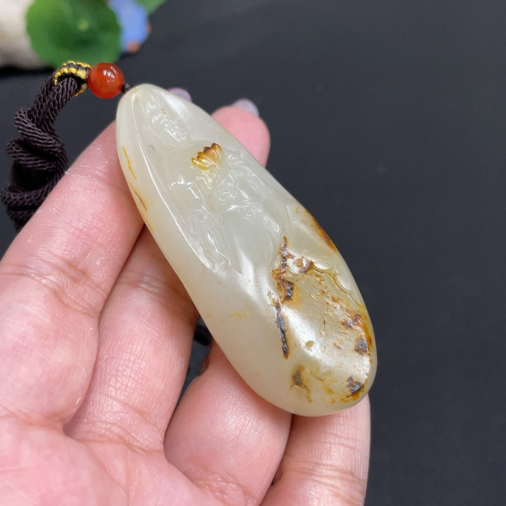 Hetian jade pendant featuring Guanyin design by HUILIU HQ, showcasing intricate craftsmanship and a smooth, polished finish.