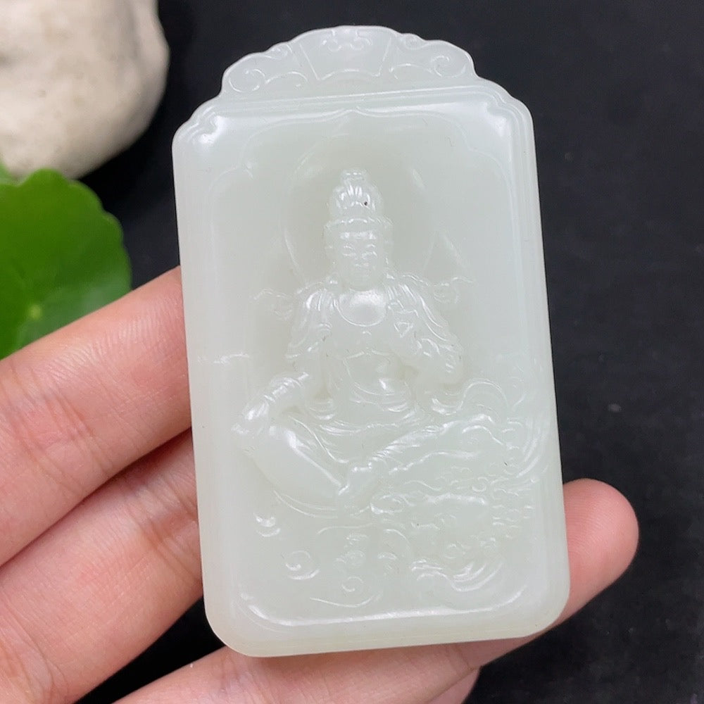 Huiliu certified Hetian jade Guanyin pendant featuring detailed carved Buddhist figure on smooth green jade.