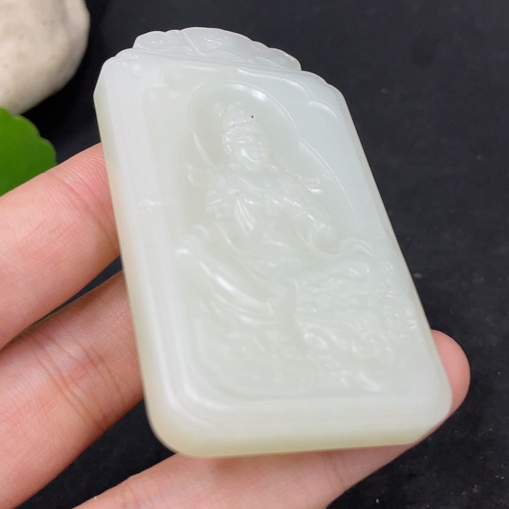 Huiliu certified Hetian jade Guanyin pendant with intricate carvings, showcasing smooth green jade craftsmanship.