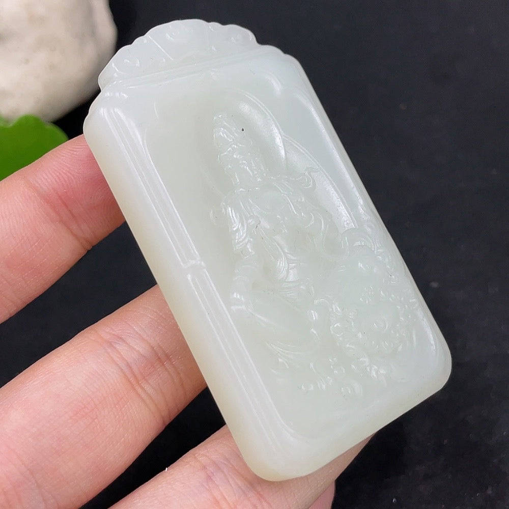 Huiliu Certified Hetian Jade Pendant featuring Guanyin figure, smooth polished surface, and detailed carving, traditional Chinese jewelry piece.